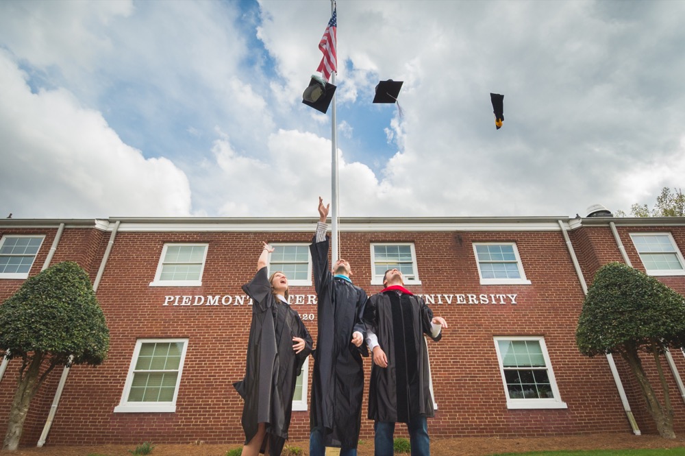 Students throwing caps into the air