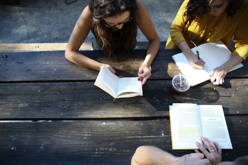 Students studying at picnic table