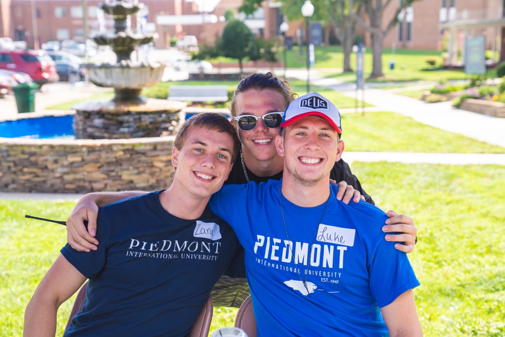 Three male students posing for the picture