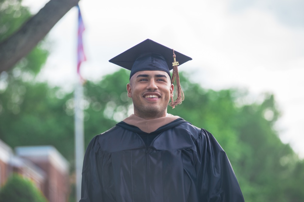 Male graduate wearing regalia