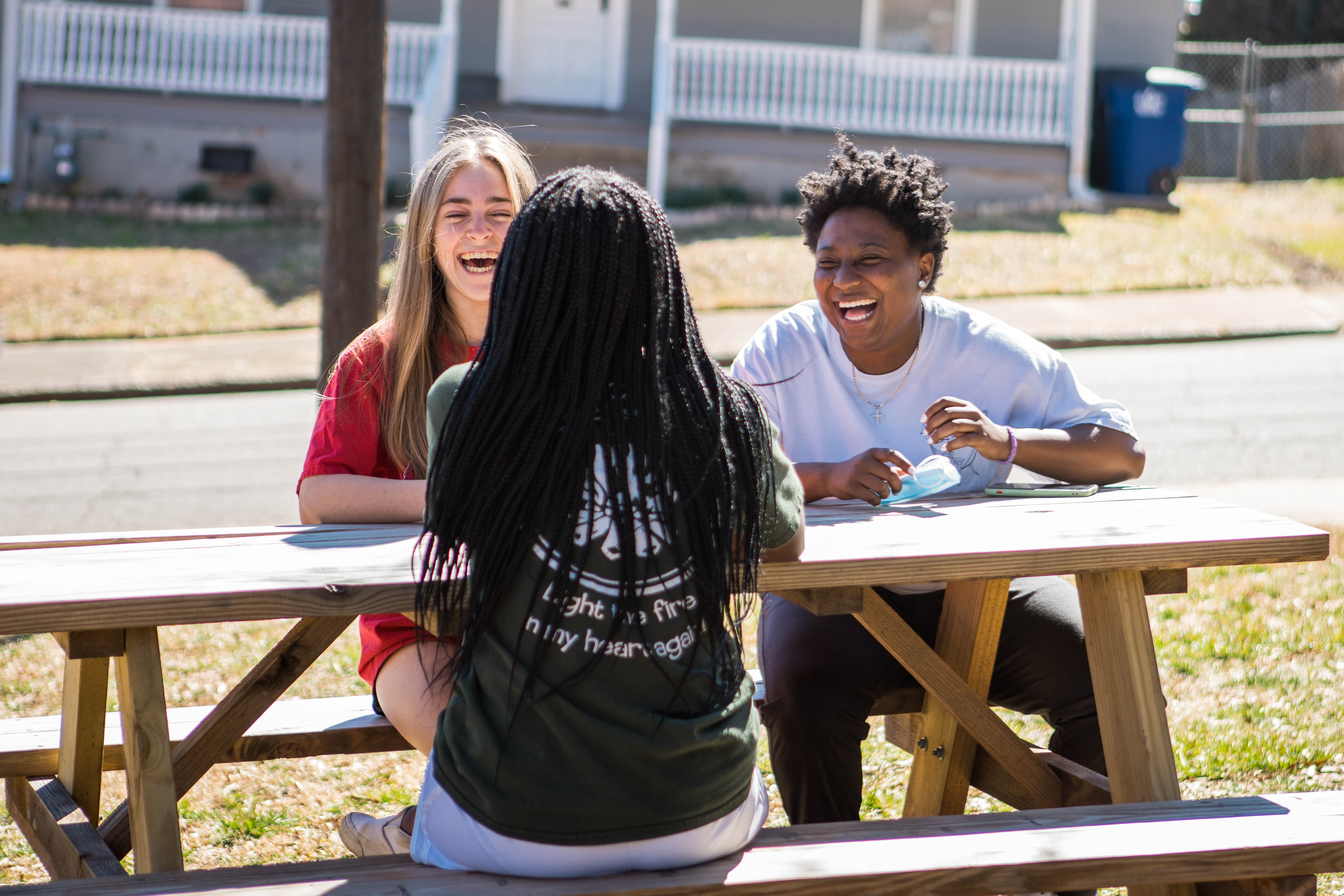 Students sitting at table laughing