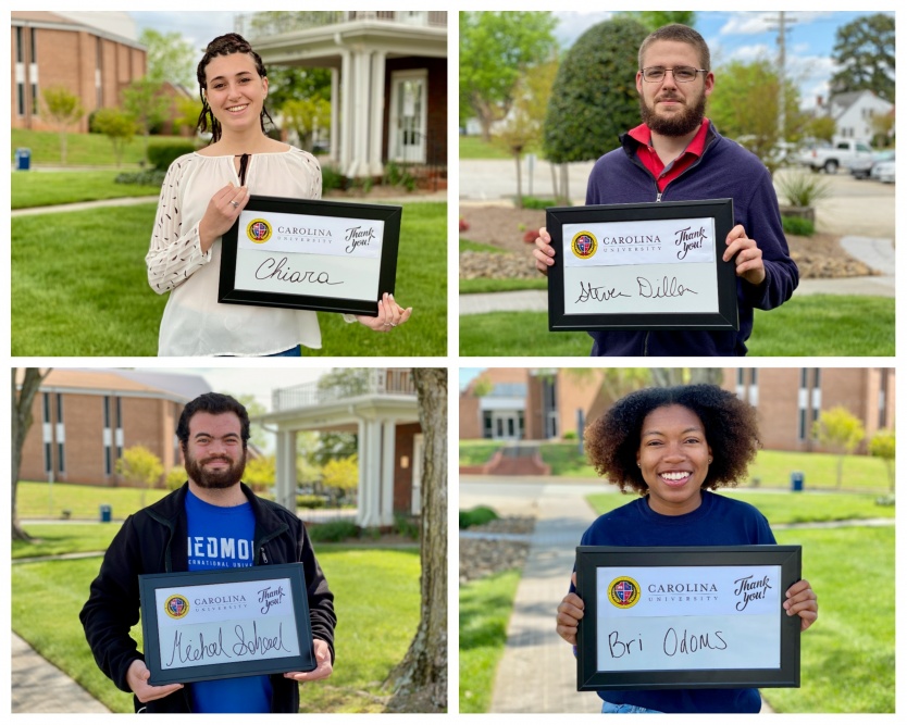 students holding thank you signs